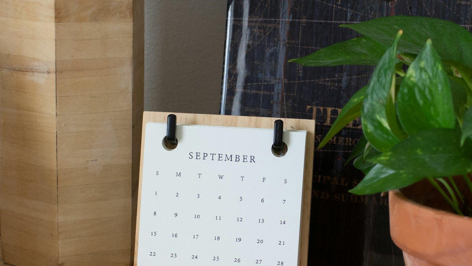 Desk calendar on a wooden shelf