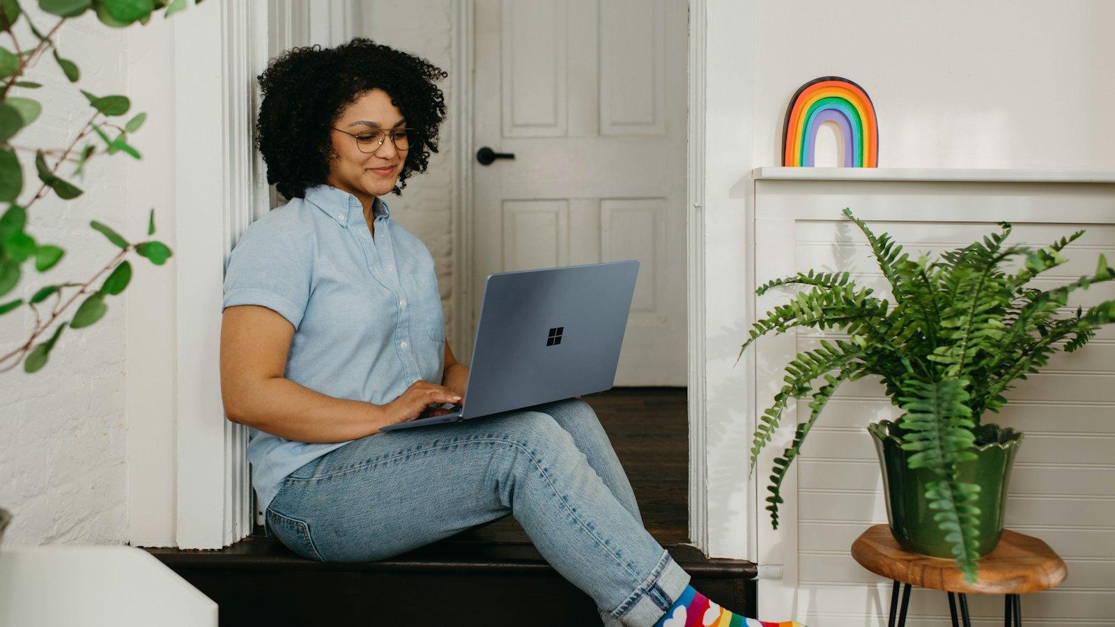 Woman using a laptop at home