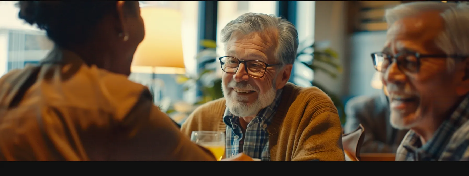 a diverse group of senior citizens smiling and chatting with a financial advisor in a cozy, well-lit office setting.
